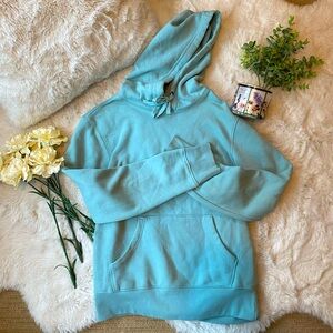 Teal blue long women’s hoodie with drawstring.